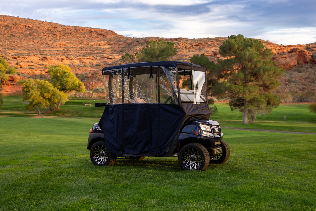 Navy Clear Vision Golf Cart Cover on course fairway with red-rock cliffs behind