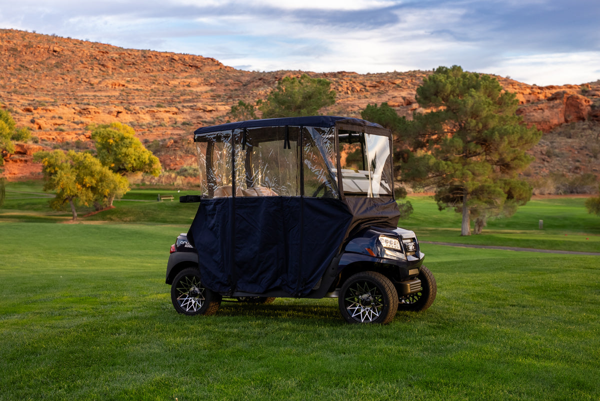Navy Clear Vision Golf Cart Cover on course fairway with red-rock cliffs behind