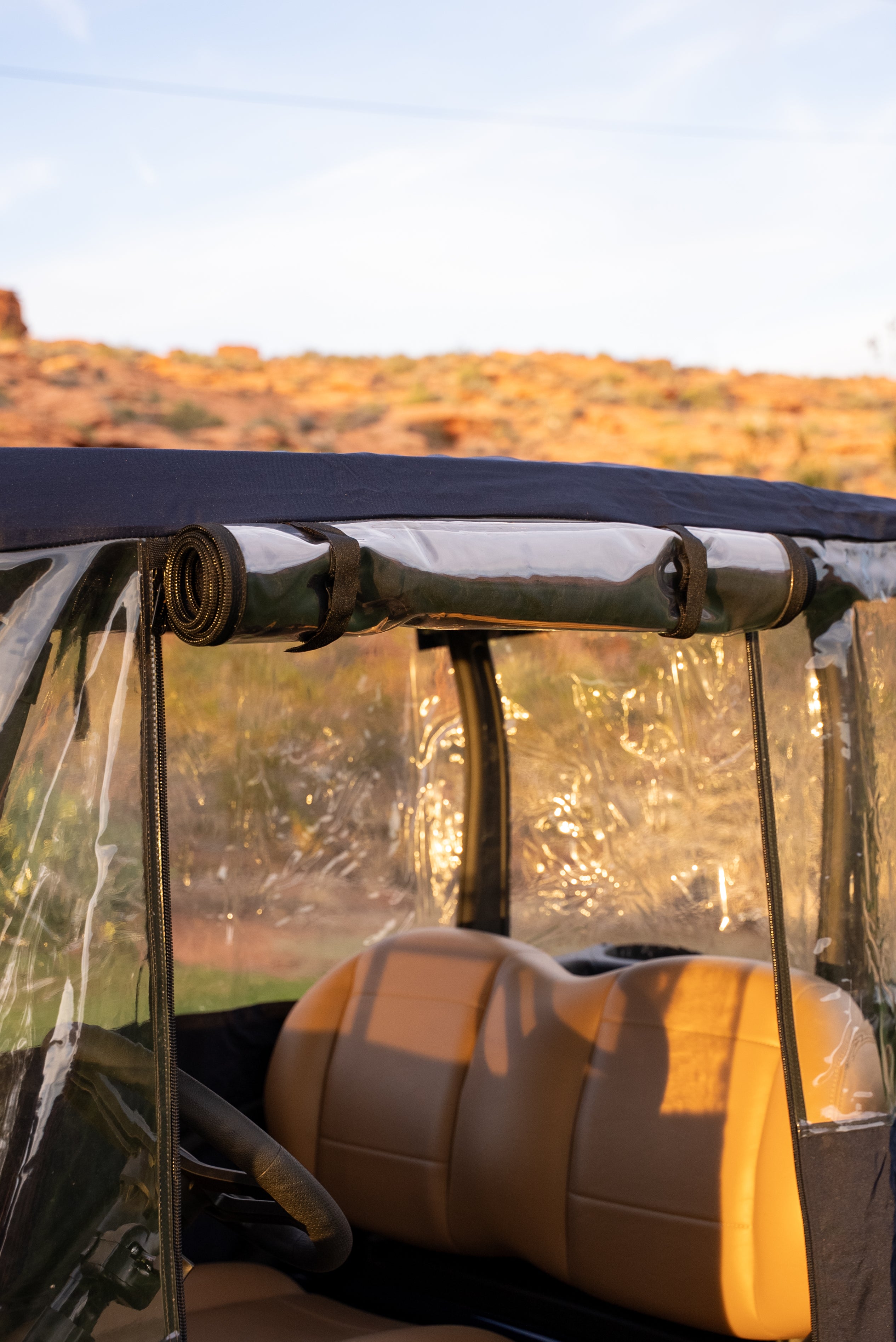 Navy Clear Vision cover with driver-side clear panel rolled up and strapped open
